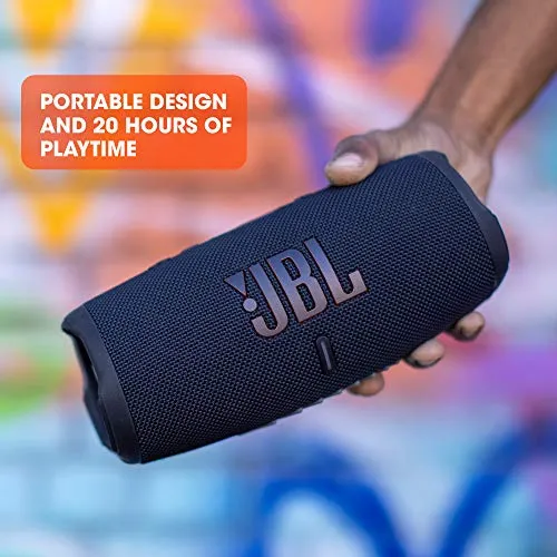 Hand holding the JBL Charge 5 outdoors, illustrating its portable design and 20-hour battery life