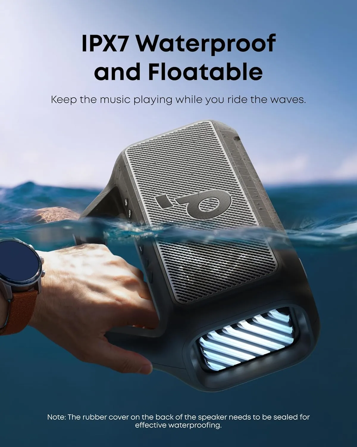 Soundcore Boom 2 floating half-submerged in water, demonstrating its IPX7 waterproof and floatable design