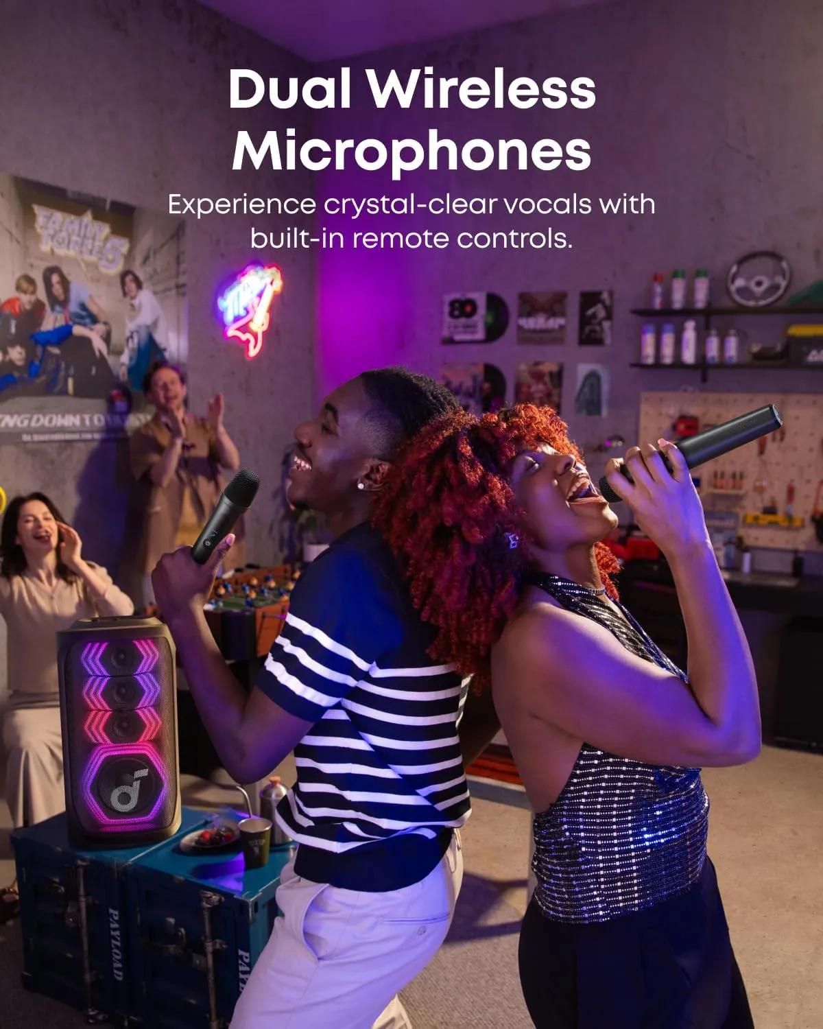 Two friends singing into the Soundcore Rave 3S dual wireless microphones at a karaoke party