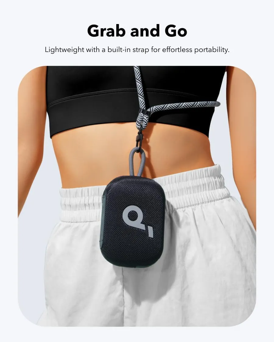 Soundcore Select 4 Go clipped to the back of a person's waistband by its strap, demonstrating lightweight grab-and-go portability