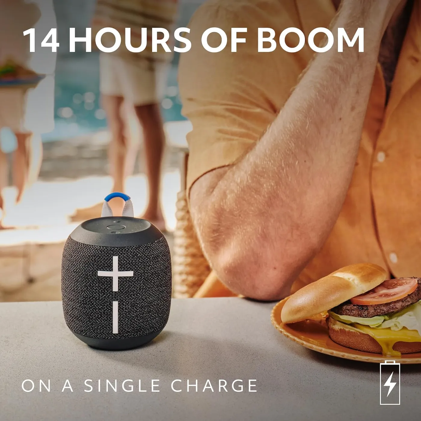 WONDERBOOM 4 in black at a picnic, with up to 14 hours of battery on a single charge