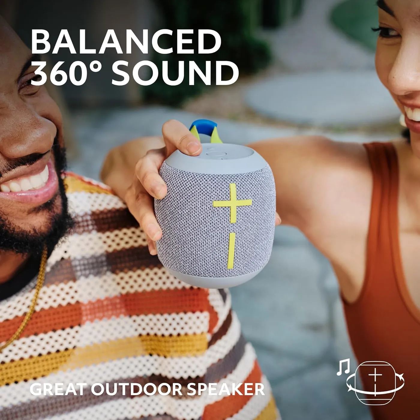 WONDERBOOM 4 in gray held outdoors, highlighting balanced 360-degree sound