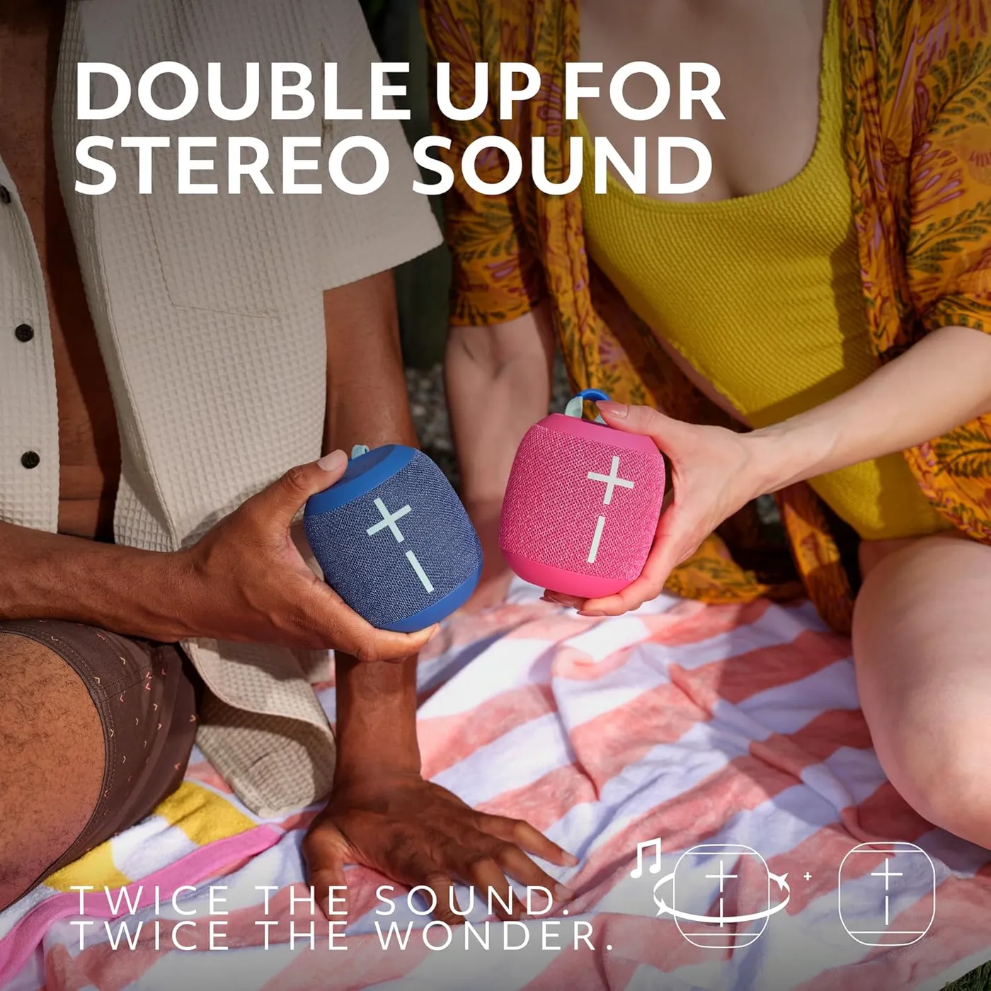 Two WONDERBOOM 4 speakers in blue and pink paired together for stereo sound