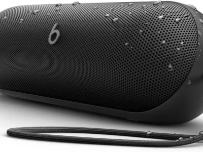 Beats Pill 2024 portable Bluetooth speaker in Matte Black with removable carry lanyard, side view