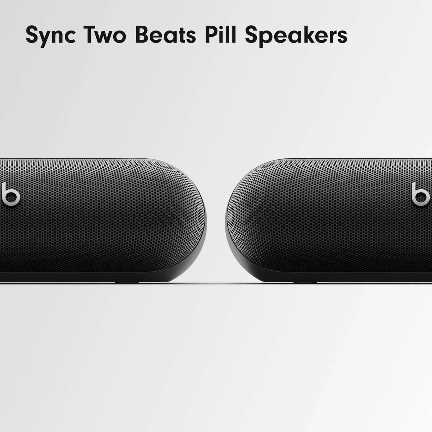 Two Beats Pill (2024) Bluetooth speakers paired side by side for stereo and Amplify modes