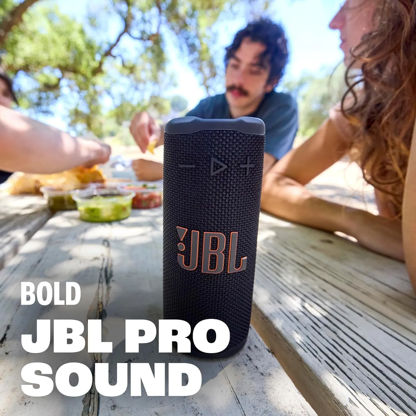 JBL Grip speaker on an outdoor picnic table, highlighting bold JBL Pro Sound