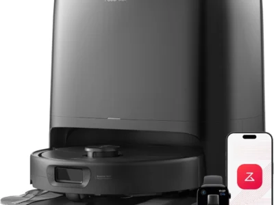 Roborock Qrevo 2 Pro robot vacuum seated in its black dock, shown with the phone app and a smartwatch