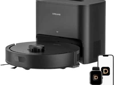 Dreame D20 Air Plus black robot vacuum docked at its tall self-empty station, with phone and watch app screens