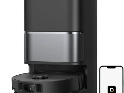 Dreame L40 Ultra Gen 2 black robot vacuum docked in its tall base station beside a phone showing the Dreame app icon