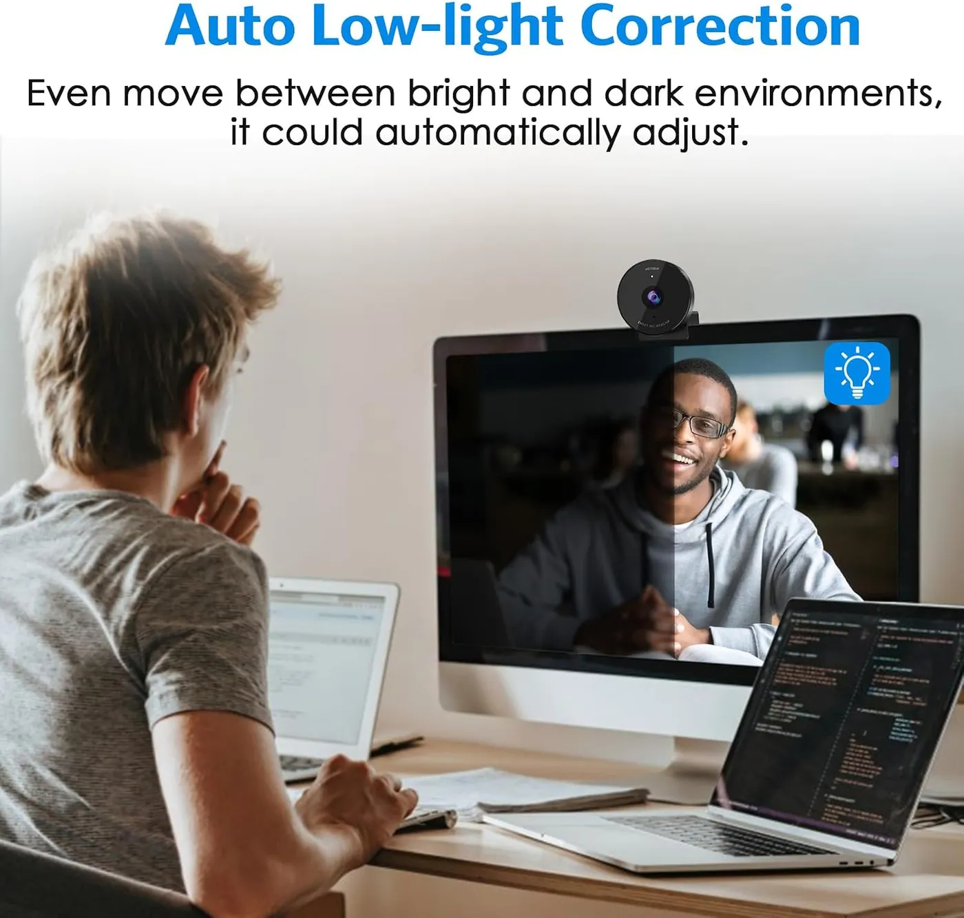 EMEET C950 1080P Webcam on a monitor at a desk, infographic of auto low-light correction with a split dark and bright image