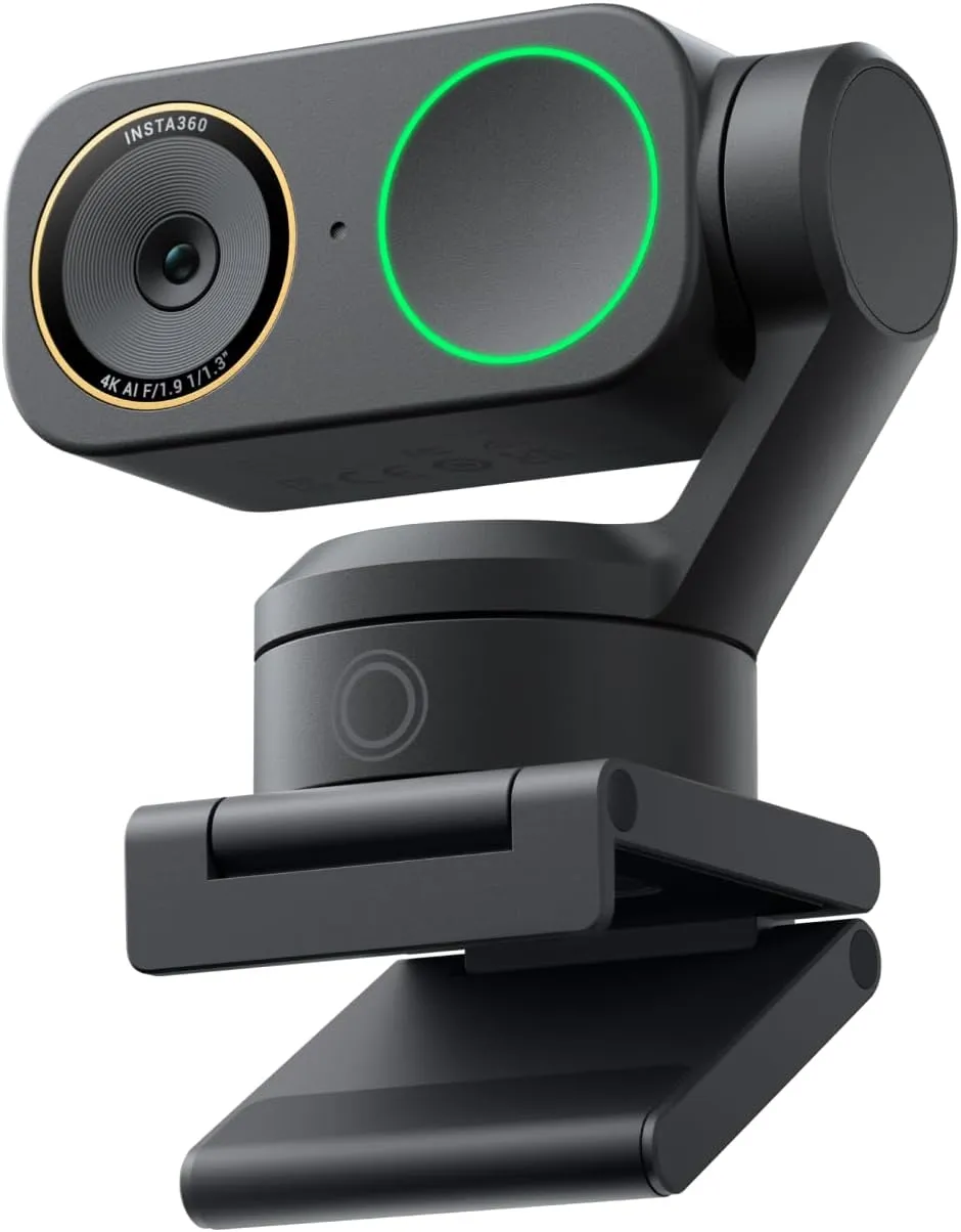 Insta360 Link 2 Pro webcam in black on its folding clip, with a green ring light and gimbal arm