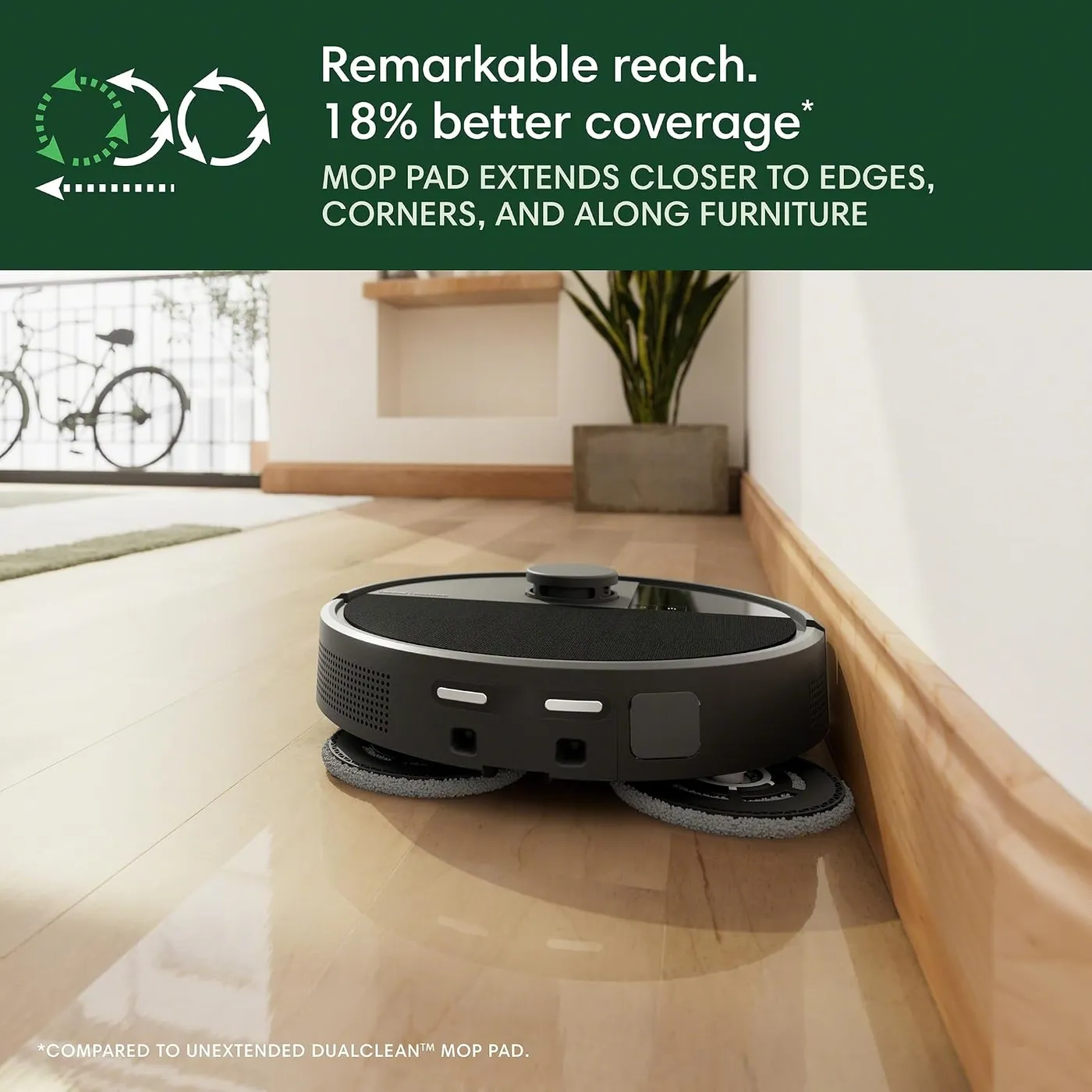 iRobot Roomba 505X with mop pads extended along a wood baseboard, infographic of the 18% better coverage claim