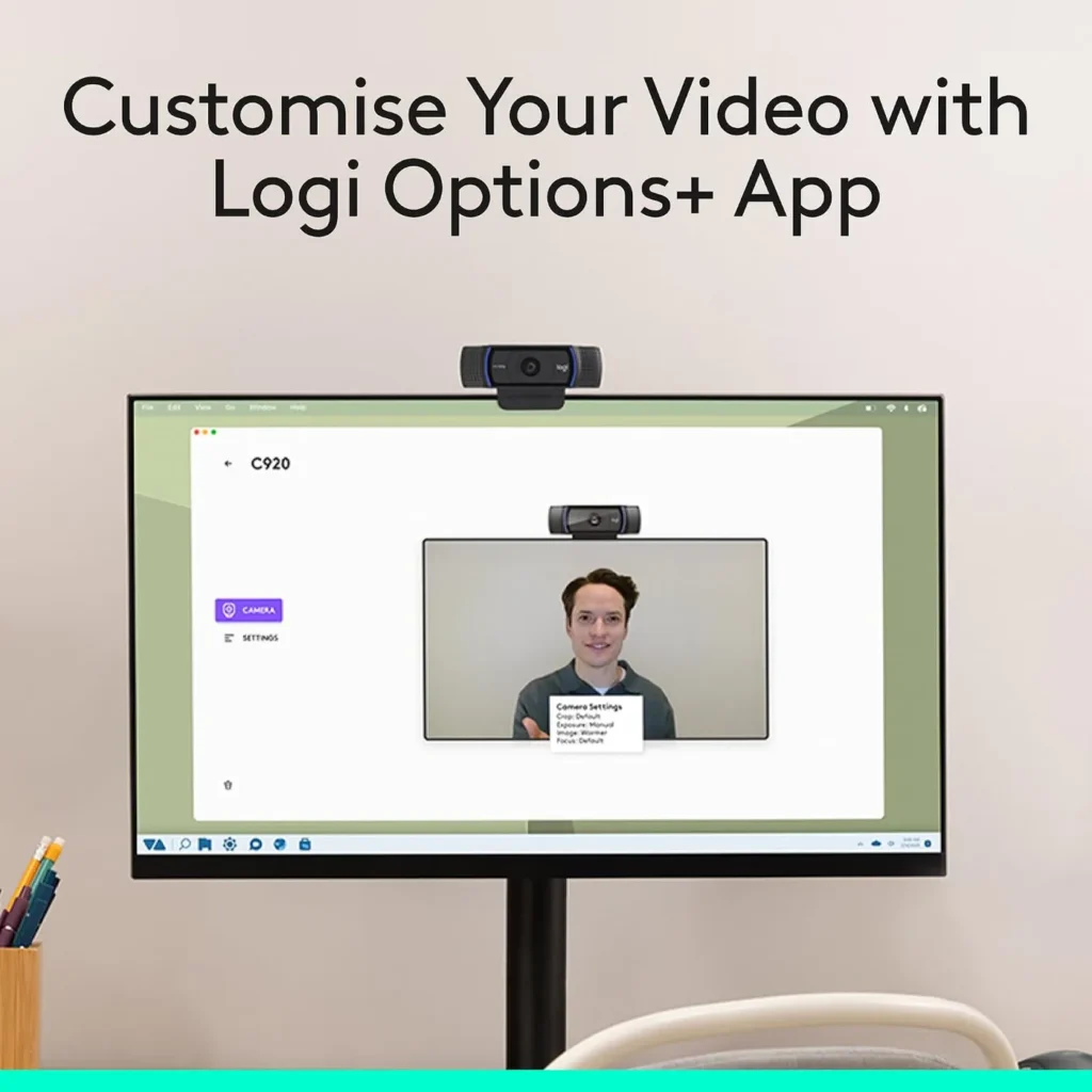 Logitech C920x HD Pro webcam above a monitor showing the Logi Options+ app camera settings screen with a live preview