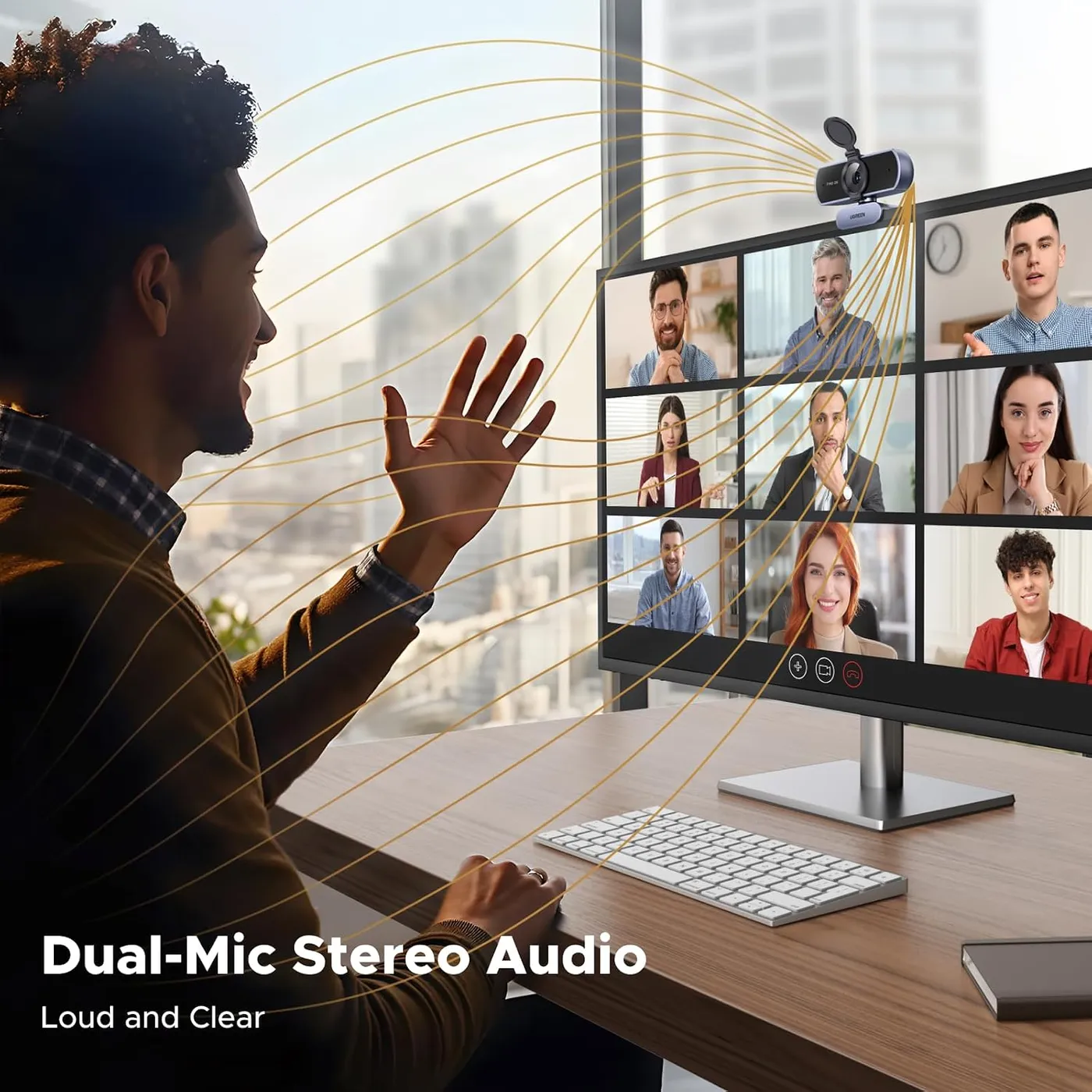 UGREEN 2K Webcam infographic of the dual-mic stereo audio claim, a man waving at a video call on a monitor